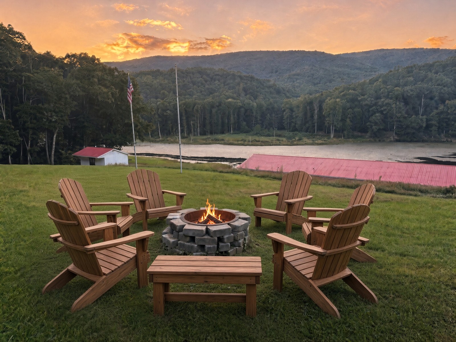 Chairs gathered around an evening fire above the lake