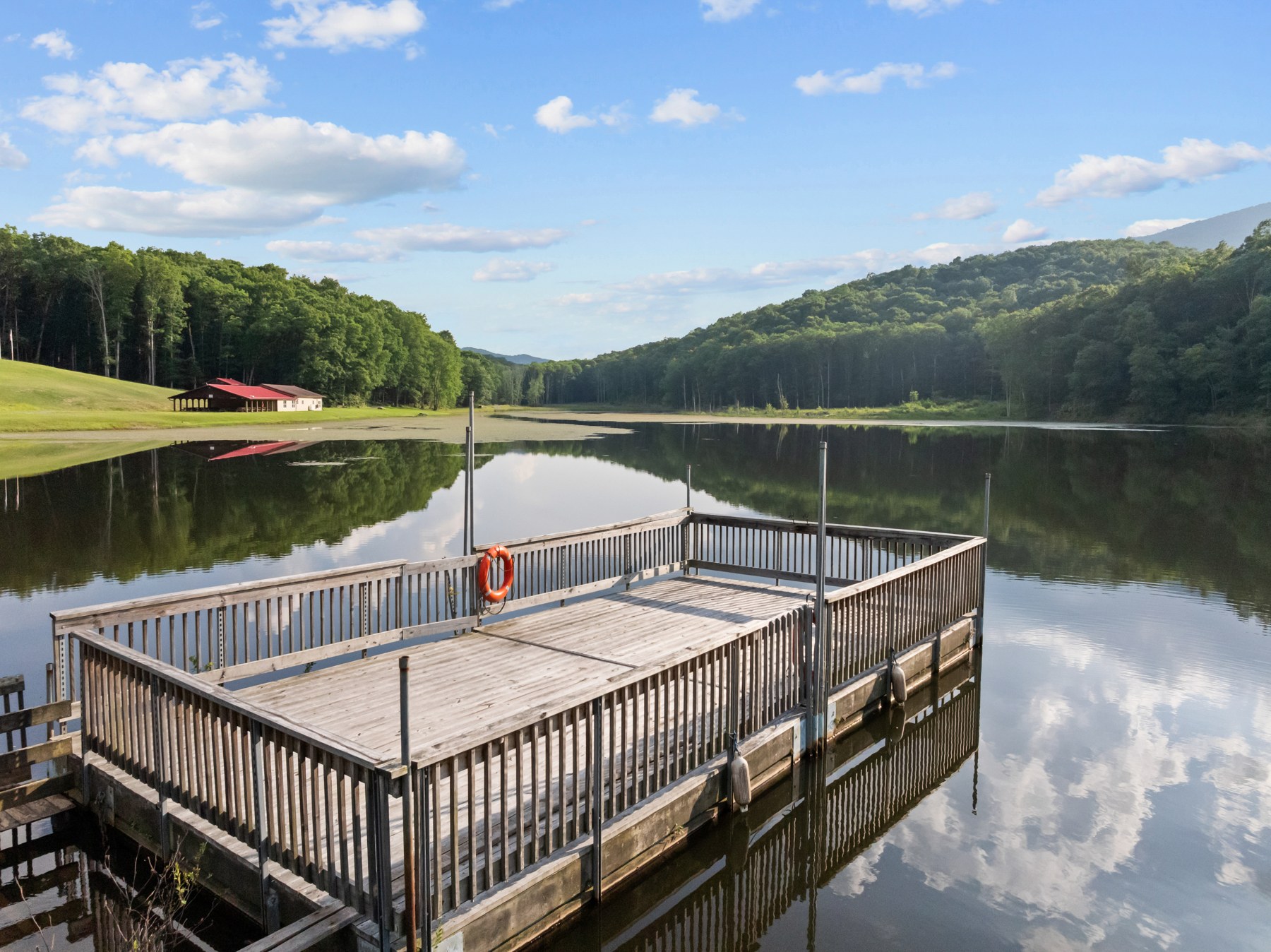 The dock on the private lake with Lake Hall across the water