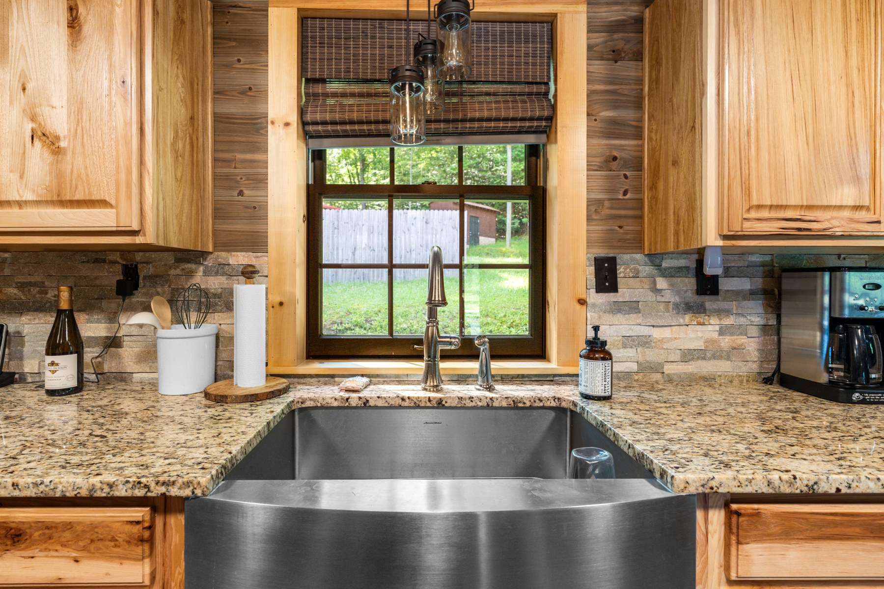 Lodge kitchen sink beneath a window overlooking the grounds